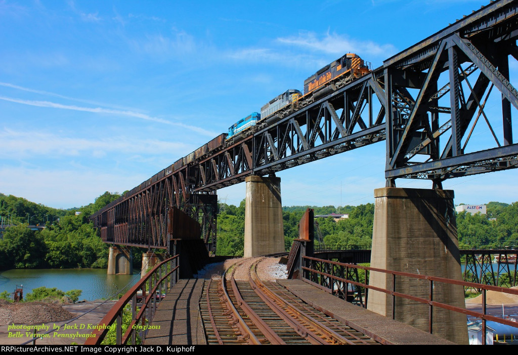 W&LE, Wheeling and Lake Erie 3068-6349-7375, leads a eastbound loaded ore train on the Speers bridge over the Monongahela River, Belle Vernon, Pennsylvania. June 3, 2011. 